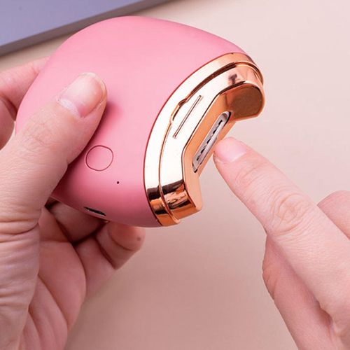 Image of an electric nail trimmer. A gadget designed to file down nails using a rotating file tool.